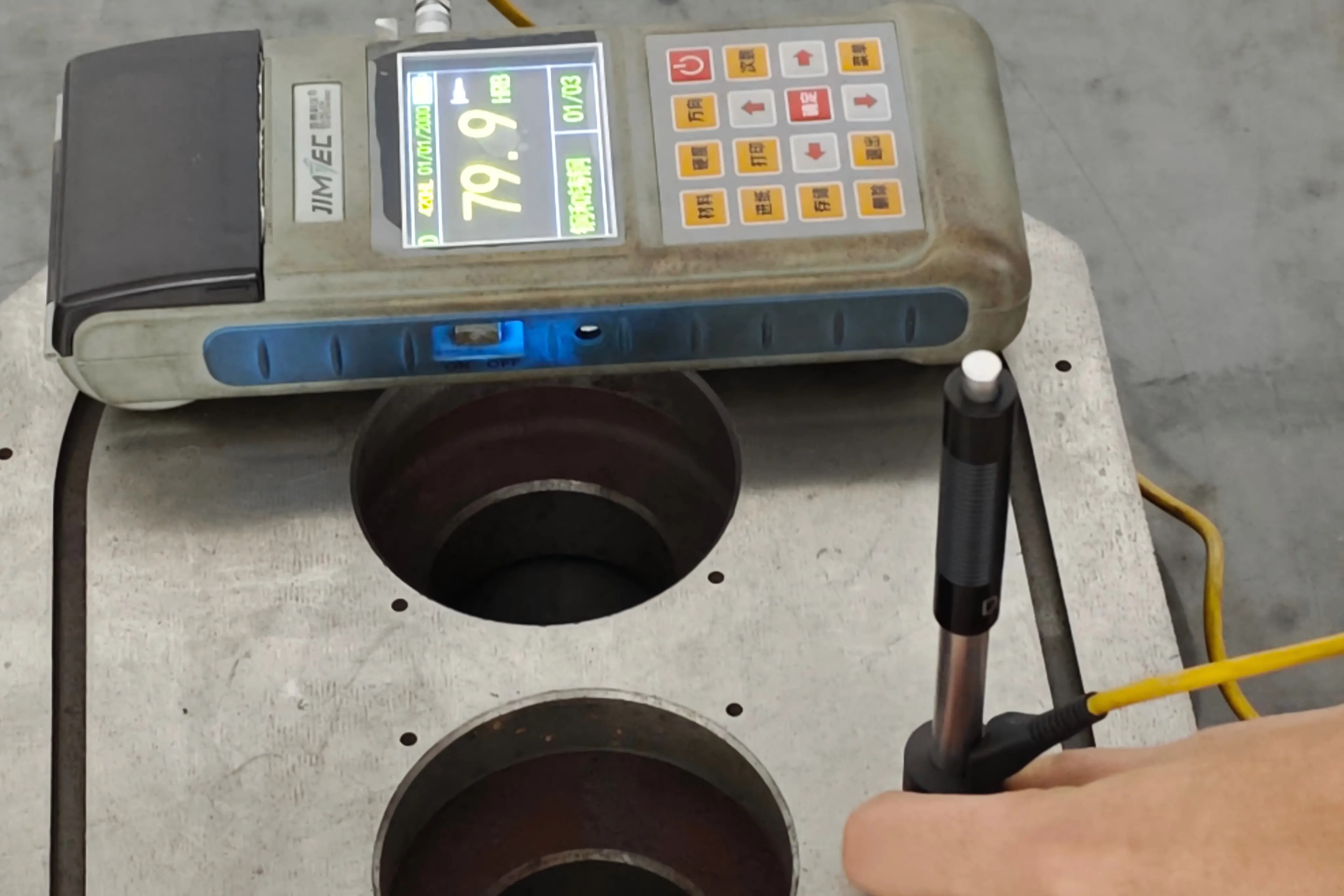 Rockwell hardness tester verifying heat-treated rotating equipment component before final precision grinding