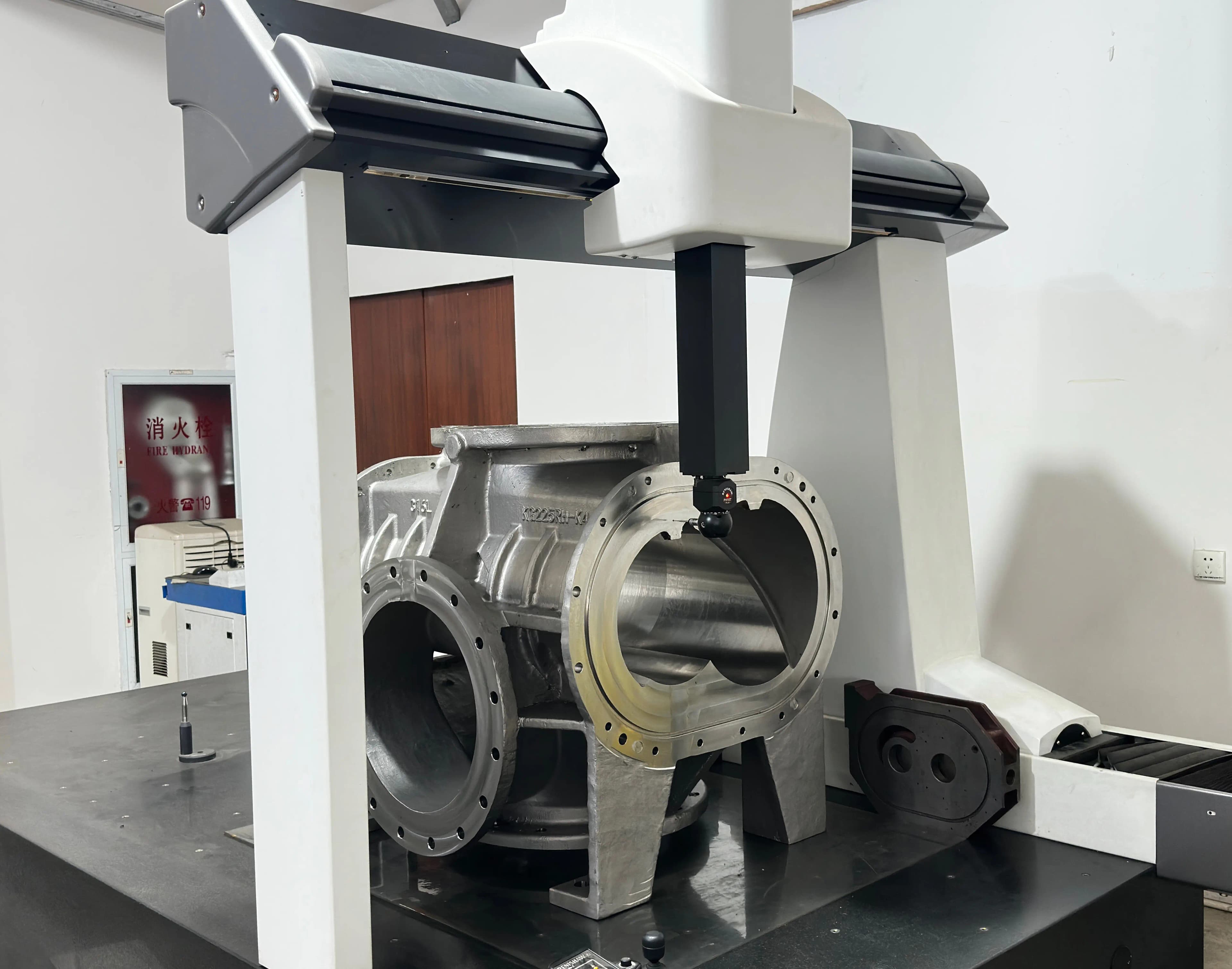 Coordinate measuring machine inspecting a precision machined component