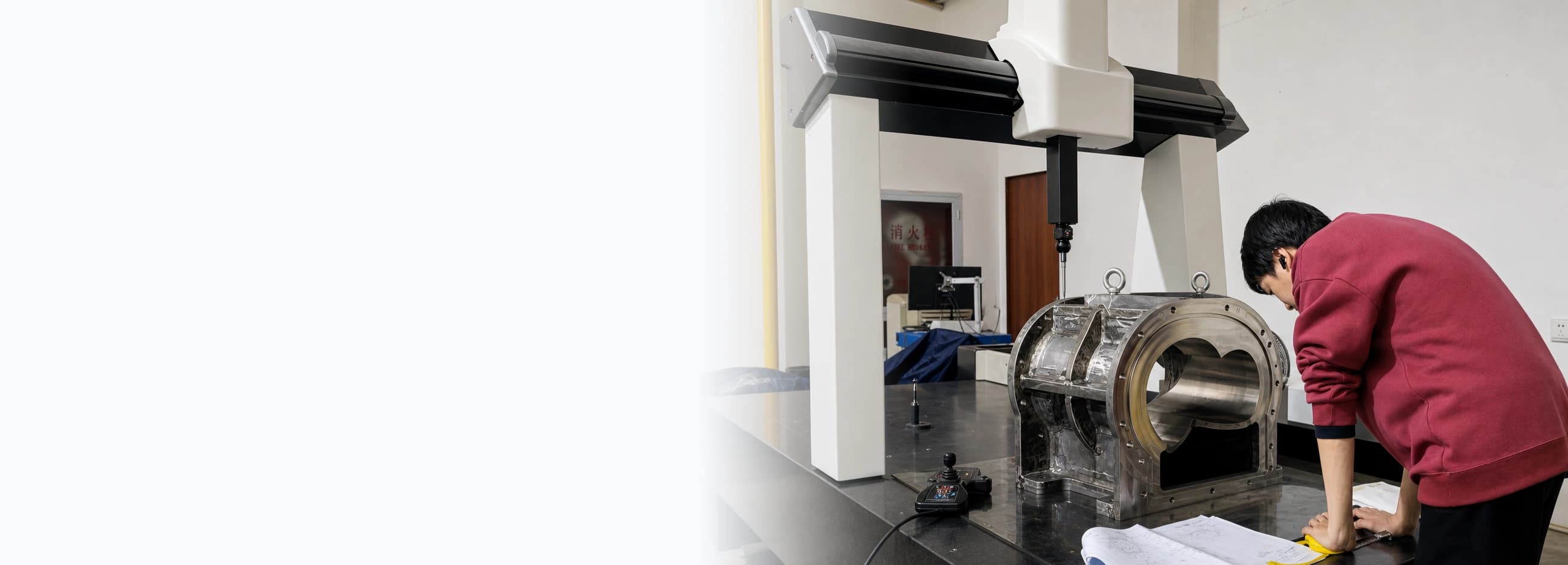 Engineer inspecting a precision CNC machined part on a CMM machine