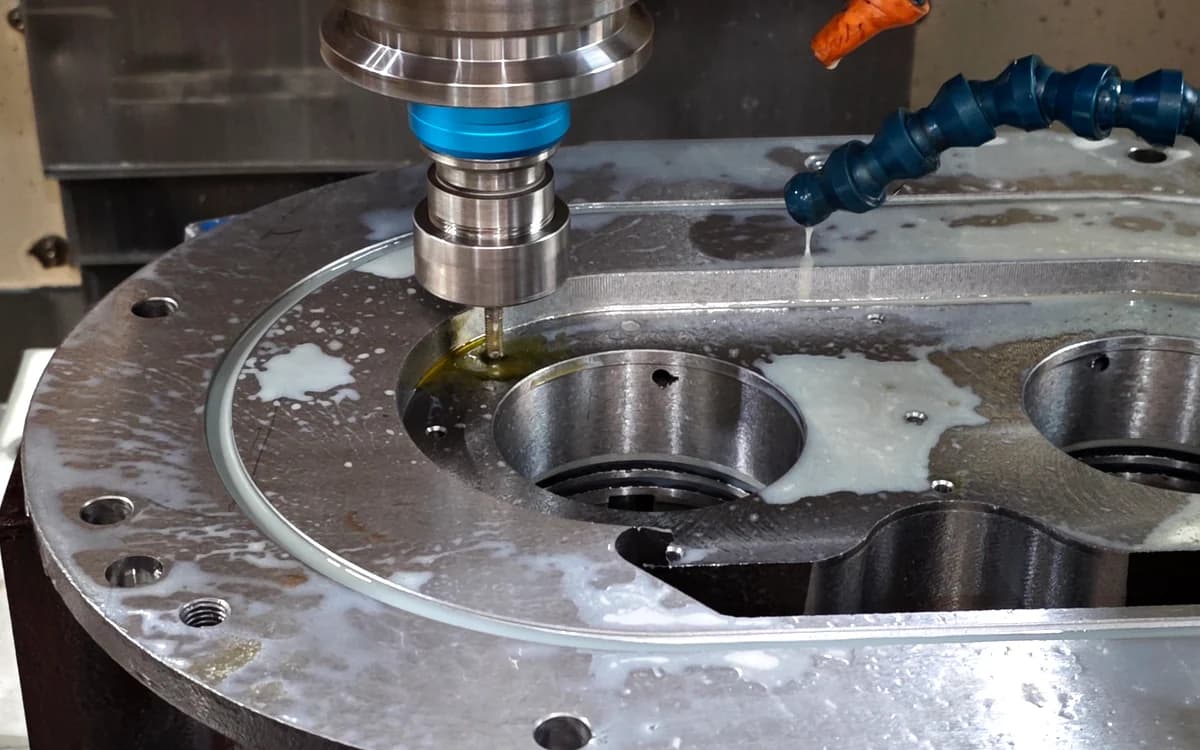 CNC milling operation producing a precision machined metal component