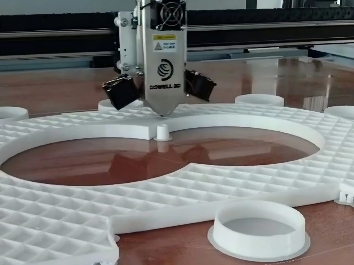 3D-printed foam pattern of a dry screw pump housing before refractory slurry coating, showing the cored internal cavities that make lost-foam the required route