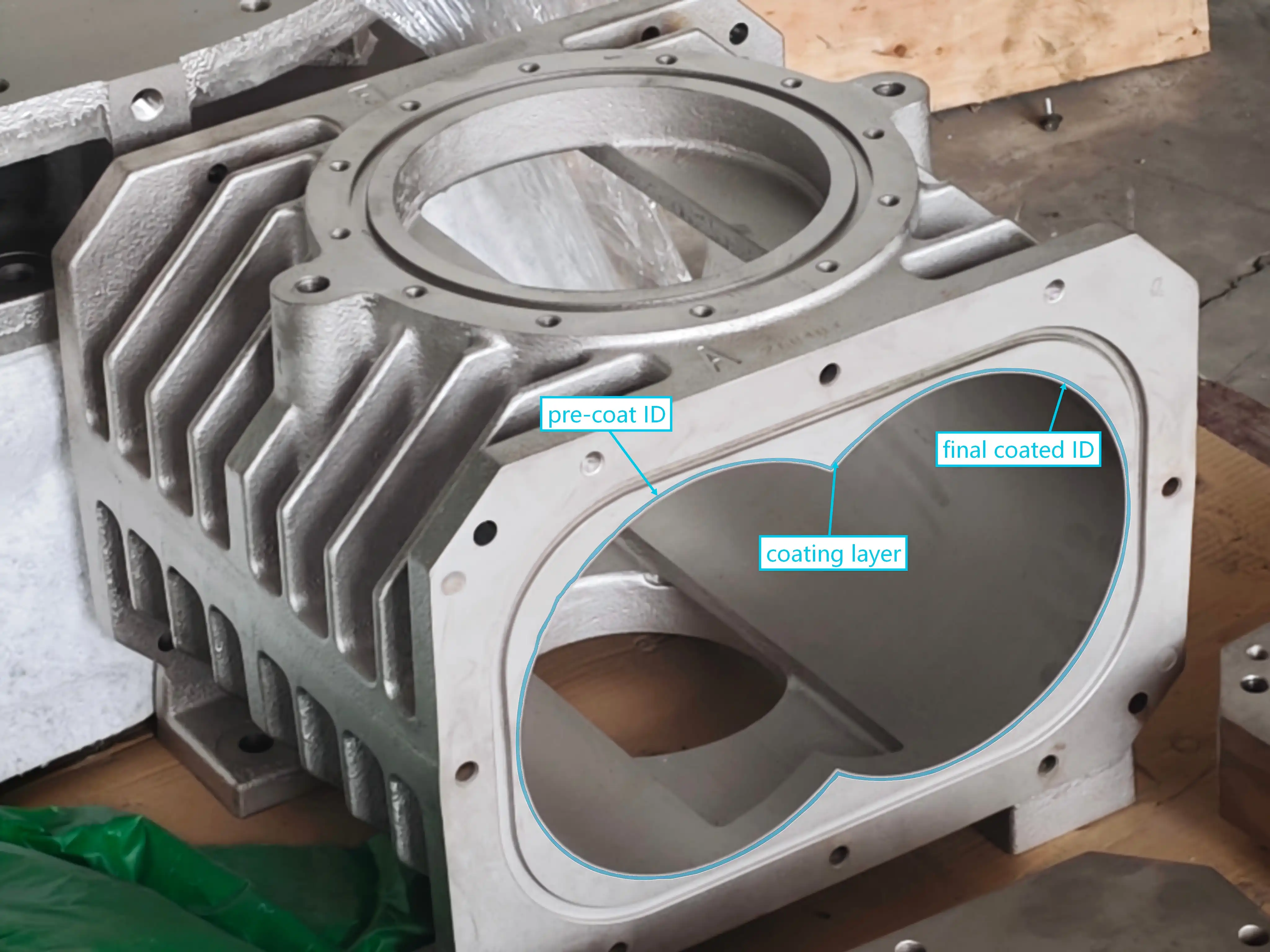 Machined dry screw pump housing bore annotated with pre-coat ID, coating layer, and final coated ID labels
