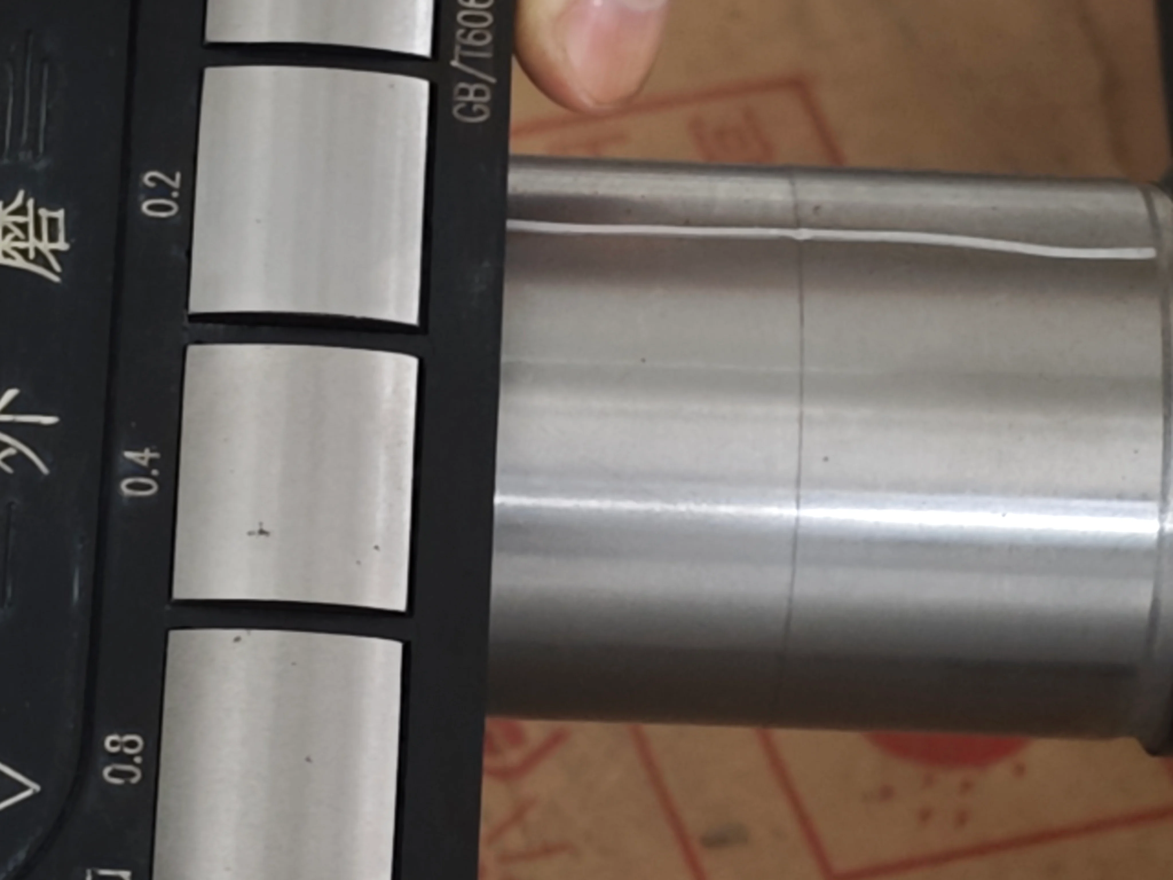 SCPM technician verifying Ra surface finish on a precision machined steel component using a portable surface roughness profilometer